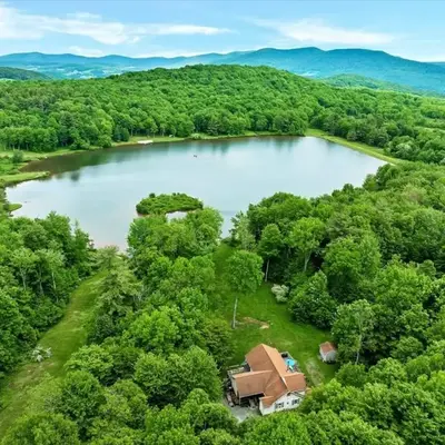 Wooded lakefront chalet with hot tub and game room