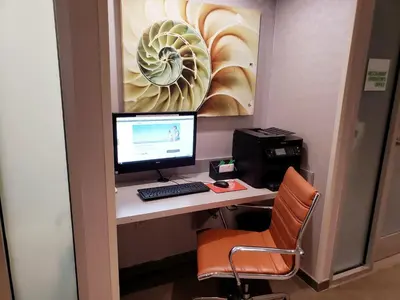 an office with a desk with a computer and a printer at Holiday Inn New York City - Times Square by IHG in New York