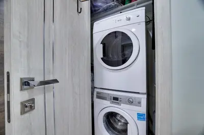 a washer and dryer sitting next to a door at Apartment Minutes from Camelback Mountain with Washer Dryer in Tannersville