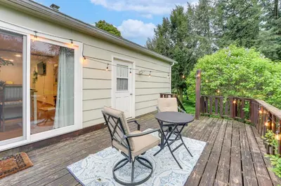 a patio with a table and chairs on a deck at Less Than 1 Mi to Main St Rural Gem in Cherry Valley in Cherry Valley