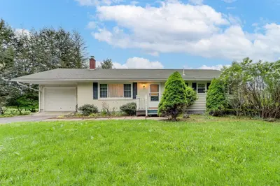 a house with a green lawn in front of it at Less Than 1 Mi to Main St Rural Gem in Cherry Valley in Cherry Valley