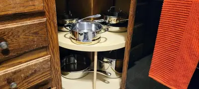 a group of pots and pans on a shelf at Massive 5BD/4BA 3-Story Duplex @ Downtown Albany in Albany