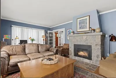 a living room with a couch and a fireplace at Majestic Family Home in Saratoga New York in Saratoga Springs