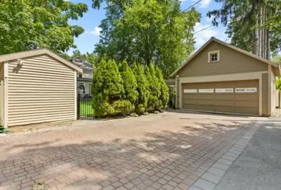 a house with a garage and a driveway at Majestic Family Home in Saratoga New York in Saratoga Springs