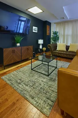 a living room with a couch and a table at The Luxe Loft in Long Island City