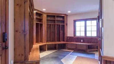 an empty room with wooden shelves and a window at Mt Snow Convenience! Steps from the lifts! Hot Tub in Dover