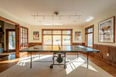 a dining room with a ping pong table in it at Mt Snow Convenience! Steps from the lifts! Hot Tub in Dover