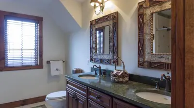 a bathroom with two sinks and a toilet at Mt Snow Convenience! Steps from the lifts! Hot Tub in Dover