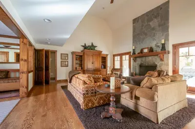 a living room with two couches and a fireplace at Mt Snow Convenience! Steps from the lifts! Hot Tub in Dover