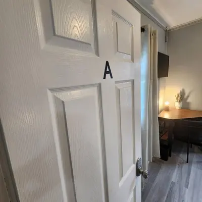 a door with the letter a written on it at Private Bedroom w Shared Space A in South Hackensack