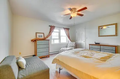 a bedroom with a bed and a ceiling fan at 2 Blocks to Beach Walkable Woodmont Village Home in Milford