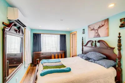 a bedroom with a large bed and a window at 4 Mi to Dtwn Catskill Mtn-View Home in Catskill
