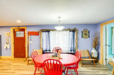 a dining room with a red table and chairs at 4 Mi to Dtwn Catskill Mtn-View Home in Catskill