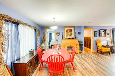 a living room with a dining room table and chairs at 4 Mi to Dtwn Catskill Mtn-View Home in Catskill