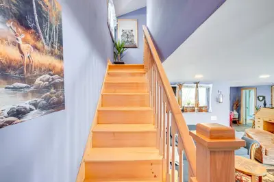 a staircase in a home with a painting on the wall at 4 Mi to Dtwn Catskill Mtn-View Home in Catskill