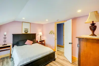 a bedroom with pink walls and a bed and a door at 4 Mi to Dtwn Catskill Mtn-View Home in Catskill