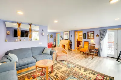 a living room with a couch and a table at 4 Mi to Dtwn Catskill Mtn-View Home in Catskill