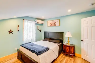 a bedroom with a bed and a window at 4 Mi to Dtwn Catskill Mtn-View Home in Catskill