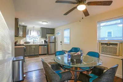 a kitchen and dining room with a table and chairs at 5•Star Fave CapeCodStyle Gem with Bedroom on Main in New Britain