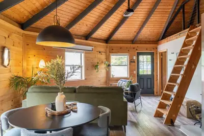 a living room with a couch and a table at The Lily Pad - Hunter NY in Elka Park