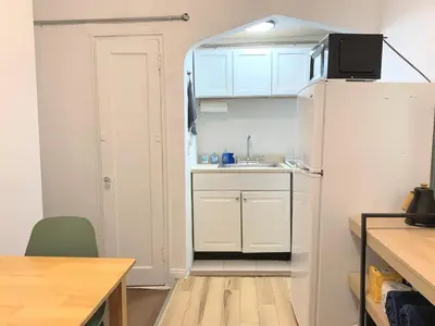a small kitchen with a sink and a refrigerator at Chelsea Studio-Shared Bathroom with Kitchen Twin Bunk Bed in New York