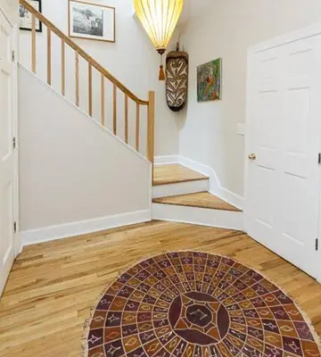 a home with a staircase with a mosaic rug at private spacious apartment with 2 bedrooms 2 bathroomss and a deck in New York
