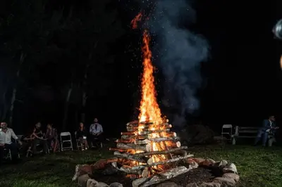 a large fire pit with a lot of fire at Serendipity Lake House in Windham