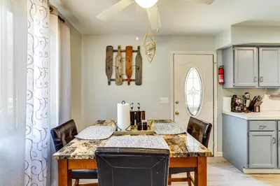 a kitchen with a table and chairs in a room at Walk to Lake Carobeth Gem in Pocono Country Place in Tobyhanna