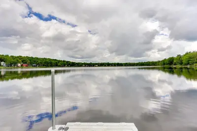 a large body of water with a cloudy sky at Walk to Lake Carobeth Gem in Pocono Country Place in Tobyhanna