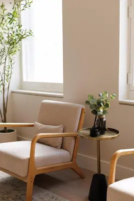 a living room with a chair and a table at RARE Luxurious Apartment 1 Block From Time Square in New York