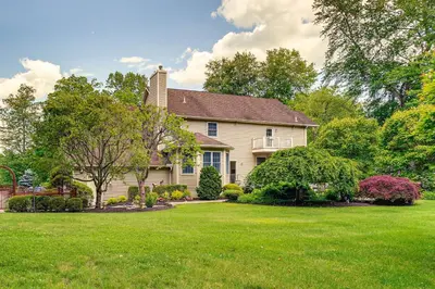a house with a yard with green grass at Serene Hudson Valley Escape with Pool and Grill in Carmel