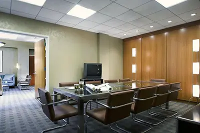 a conference room with a table and chairs and a tv at Blueground Chelsea rooftop nr The High Line NYC-1201 in New York