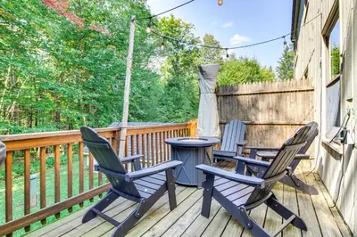 two chairs and a table on a deck at 3 min to Mt Snow with FREE Shuttle! Family-Size fun, Wood fireplace, 2 living rooms, Arcades in Dover