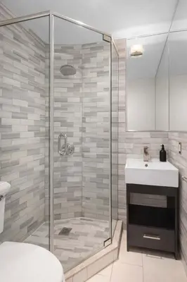 a bathroom with a shower and a sink at Stylish East Side Escape Steps from Fun in New York