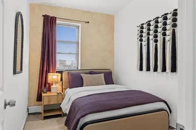 a bedroom with a bed and a window at Style & Comfort 3 Rooms -15 min from NYC in West New York