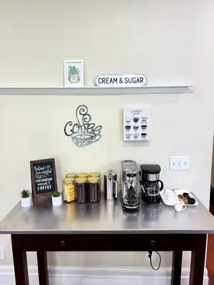 a counter top with a coffee maker on it at Nintendo, Filtered H2O, Cafe, Central, Self-Check in Troy