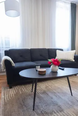 a living room with a couch and a coffee table at Sunny 4BR/2BA Retreat in Morningside Heights, NYC in New York
