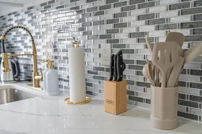 a kitchen counter with knives and utensils on it at Style & Comfort 3 Rooms 15 min from NYC in West New York
