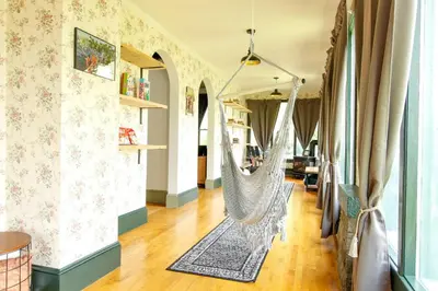 a room with a hammock hanging from the wall at Expansive Victorian close to Saratoga Springs and Lake George in Corinth
