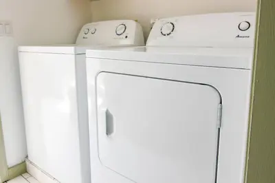 a white washer and dryer in a laundry room at Expansive Victorian close to Saratoga Springs and Lake George in Corinth
