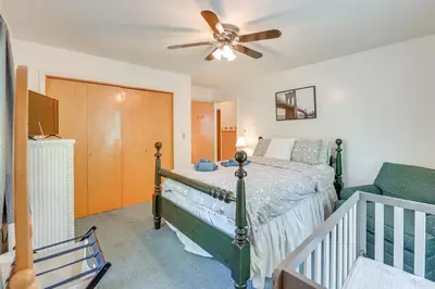 a bedroom with a bed and a ceiling fan at 1 Mi to Hunter Mtn Cozy Unit on 6-Acre Property! in Hunter