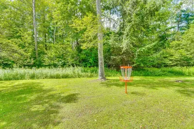 a frisbee golf basket in the middle of a yard at 1 Mi to Hunter Mtn Cozy Unit on 6-Acre Property! in Hunter