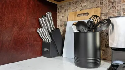 a container of utensils is sitting on a counter at Luxury Retreat Walk 2 PATH NYC in Mins Parking in Jersey City