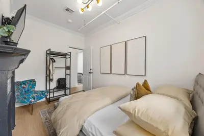 a bedroom with a bed and a fireplace at 3BR Harlem Stay with Washer with Dryer in New York