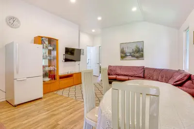 a living room with a couch and a table at 6 Mi to State Park Mongaup Valley Cabin! in Mongaup Valley