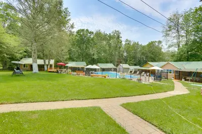 a large yard with a pool and some buildings at 6 Mi to State Park Mongaup Valley Cabin! in Mongaup Valley