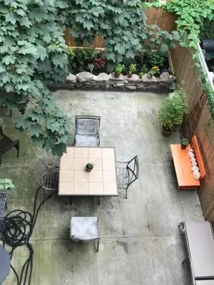 an overhead view of a table and chairs and plants at Garden Apartment in New York