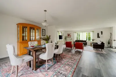 a living room with a dining table and chairs at Upstate NY Escape - Game Ready, Game Room, Pool Table, Firepit, Delaware River in Sparrow Bush
