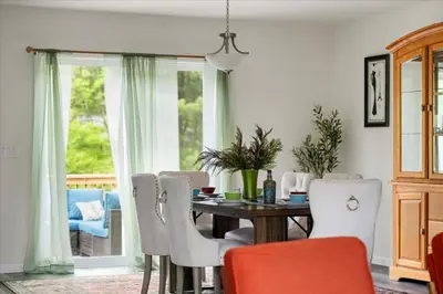 a dining room with a table and chairs at Upstate NY Escape - Game Ready, Game Room, Pool Table, Firepit, Delaware River in Sparrow Bush