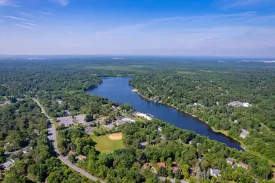 an aerial view of a river with houses and trees at Cozy Lakefront Poconos Cabin Hot Tub Kayaks in Tobyhanna
